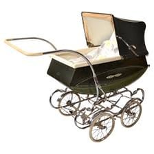 A traditional British pram used to carry a baby.
