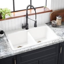 A kitchen sink with two basins