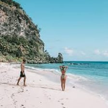 A lone castaway on a tropical island beach