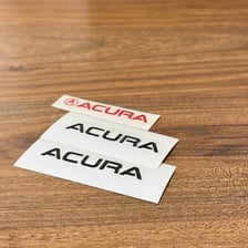 The Acura emblem, whose shape is designed to evoke a precision caliper