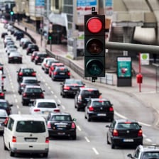 A car waiting at a red traffic light.