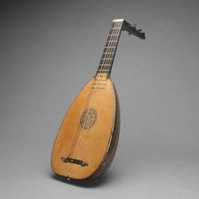 A wooden lute, a plucked string instrument related to the guitar.