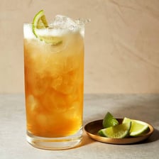 A Dark ’n’ Stormy cocktail in a glass with dark rum and ginger beer.