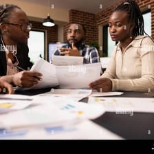 A group of colleagues appearing to agree during a meeting.