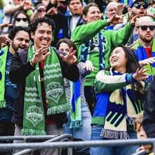 Seattle Sounders FC players competing in a soccer match.