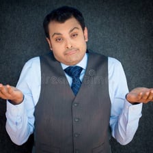 A person shrugging to express indifference