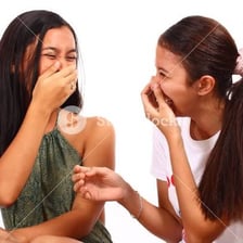 A person laughing with a playful expression