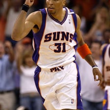 A basketball player wearing a Phoenix Suns uniform.