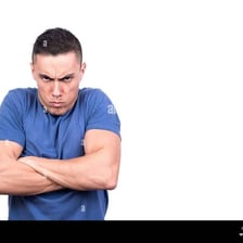 A person visibly sulking with crossed arms.