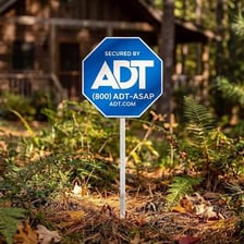 An ADT home-security sign outside a house