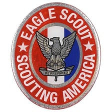 A Boy Scout wearing an Eagle Scout badge or uniform