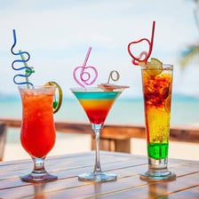 Colorful flexible drinking straws bent into different shapes