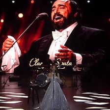 A singer performing Puccini’s aria “Nessun dorma” on an opera stage