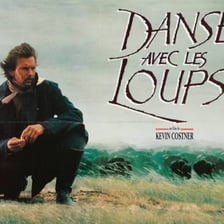 Movie posters for Flashdance and Dances with Wolves shown together.
