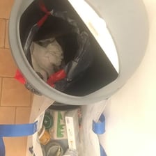 A pile of rotting garbage associated with an unpleasant odor.