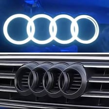 The four-ring Audi logo displayed on a car grille