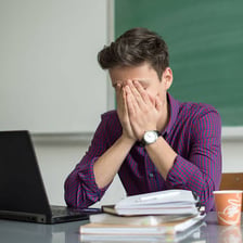 A person reacting to a mistake while working