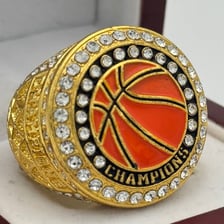 Basketball championship rings displayed together.