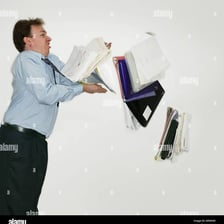 A person awkwardly dropping objects