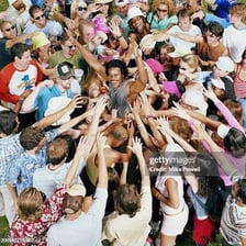 A highly emotional crowd reacting with intense excitement