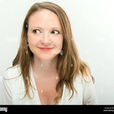 A person trying to suppress a small amused laugh.