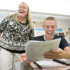 High school students taking a standardized classroom exam.