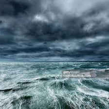 A storm visibly approaching across the horizon.