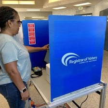 Voters casting ballots at a polling station during a general election.