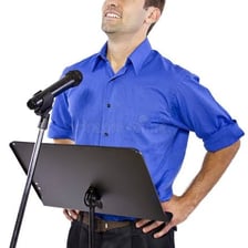 A person making a public announcement with a microphone
