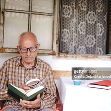 A person passing time while reading.