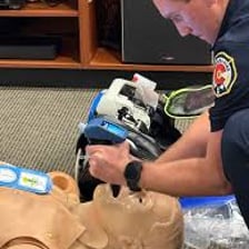 An emergency medical technician performing CPR