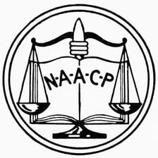 A sign displaying the NAACP name