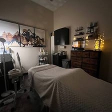 A calm spa treatment room prepared for relaxation.