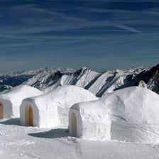 A domed igloo made of snow blocks
