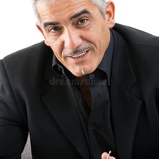 A person taking a small sip from a cup of tea