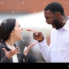 Two people engaged in an angry argument.