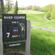 A golfer recording a par score on a golf course.