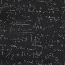 A chalkboard displaying algebraic equations involving x and y