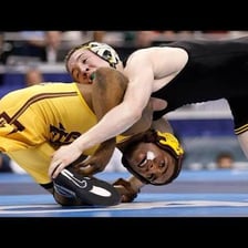 Anthony Robles competing in a wrestling match on one leg.