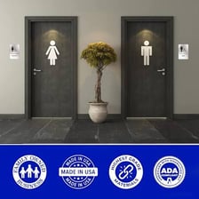 A restroom door bears a sign identifying it as the women’s room.