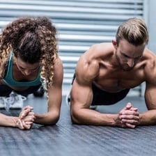 Two people facing each other in a playful challenge