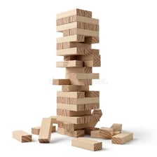 A tall Jenga tower of wooden blocks leaning precariously.