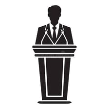 A speaker delivering a formal speech at a podium