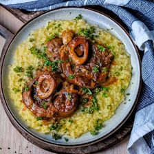A serving of osso buco with a braised veal shank.