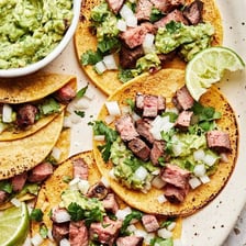 Tacos filled with grilled carne asada.