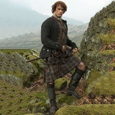 A young Scottish man in a traditional setting.