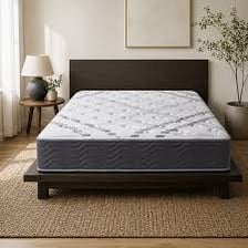 A firm mattress in a bedroom.