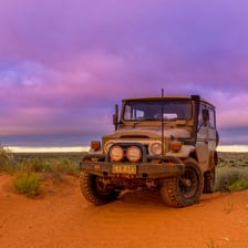A four-wheel-drive vehicle on an off-road trail