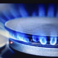A hot kitchen with heat rising from a stove