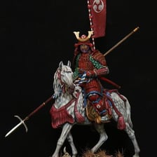 An armored samurai warrior riding a horse